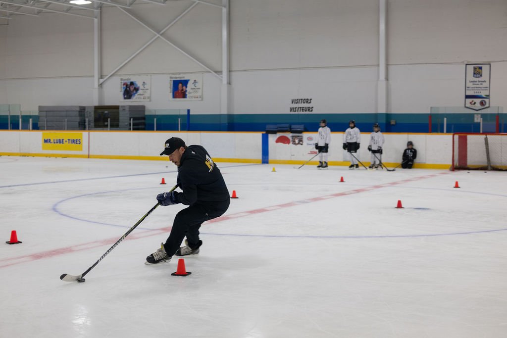 Craig Nooyen coaching on ice